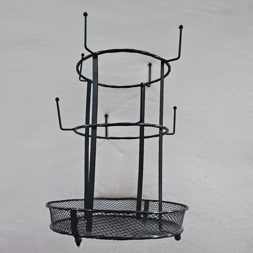 Black multi-tier metal mug tree holder with a basket base